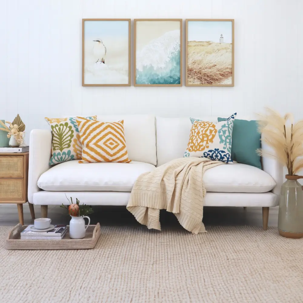 A set of cotton linen cushions feature in a room that has a beach theme.