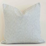 Vibrant striped outdoor cushion cover in a stylish square shape with blue colouring.
