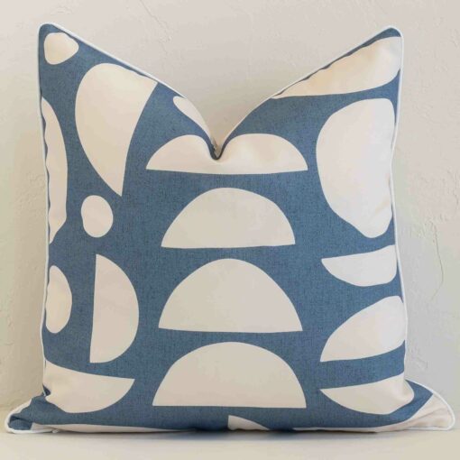 Gorgeous square outdoor cushion cover that has a blue hue. It has a graceful geometric design.