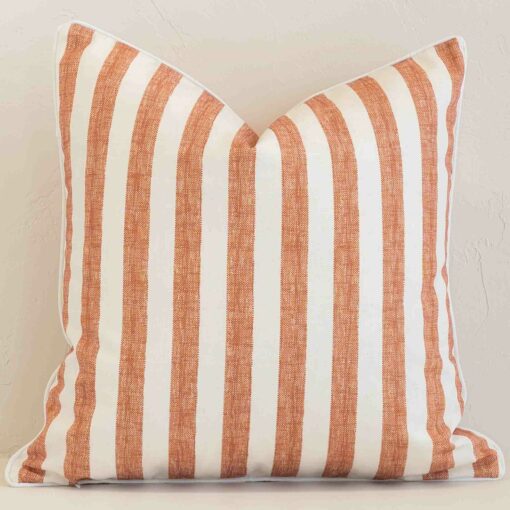 An eye-catching outdoor square cushion cover featuring a hue that is rust. It has a unique stripe style.
