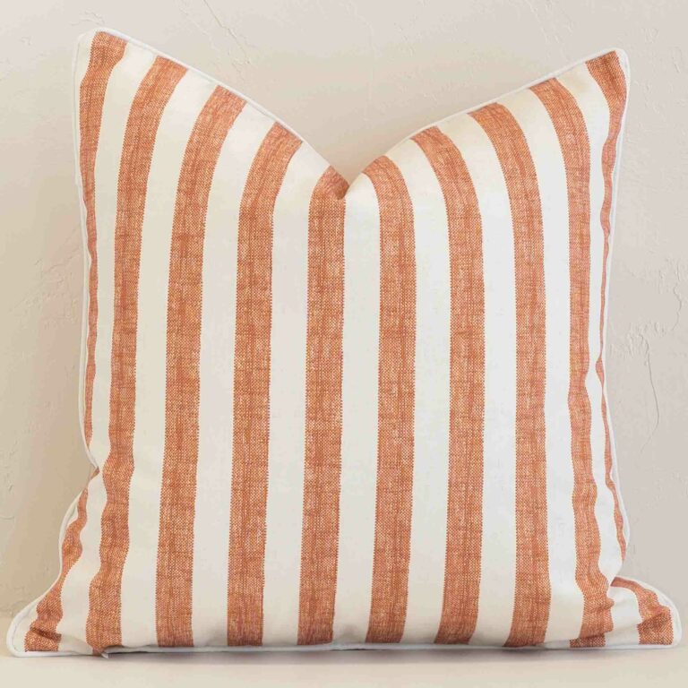 An eye-catching outdoor square cushion cover featuring a hue that is rust. It has a unique stripe style.
