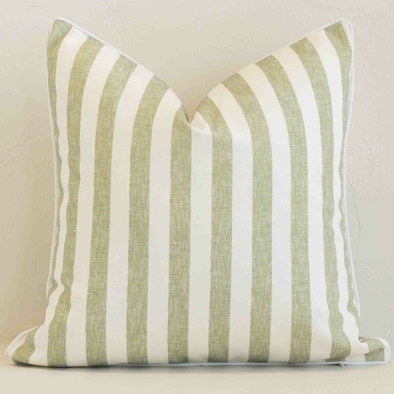 Sage stripe cushion cover sits against a white wall. It is constructed from a superior looking outdoor material and has square dimensions.