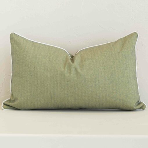 A bold solid-coloured outdoor cushion in a sleek rectangle size with a sage tone of colour.