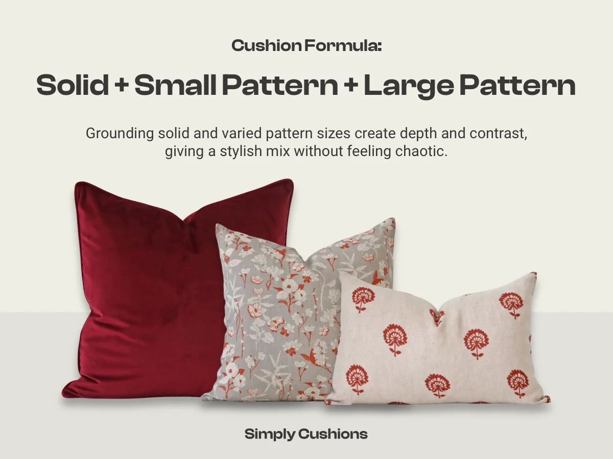 Cushion combination formula: solid + small pattern + large pattern shown with relevant cushions with deep red colours a floral patterns.
