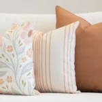 3 outdoor couch cushions in a desert bloom colour shown on a seat.