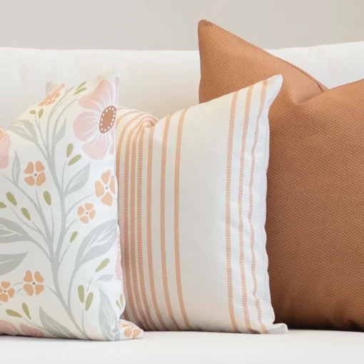 3 outdoor couch cushions in a desert bloom colour shown on a seat.