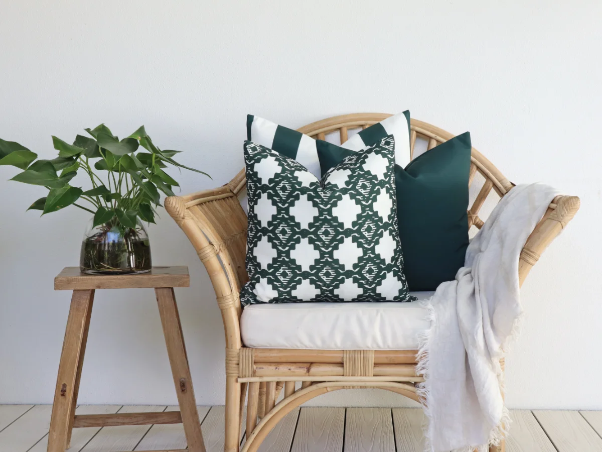 An example of how to choose outdoor cushions done right with an attractive set of green designs on a chair.