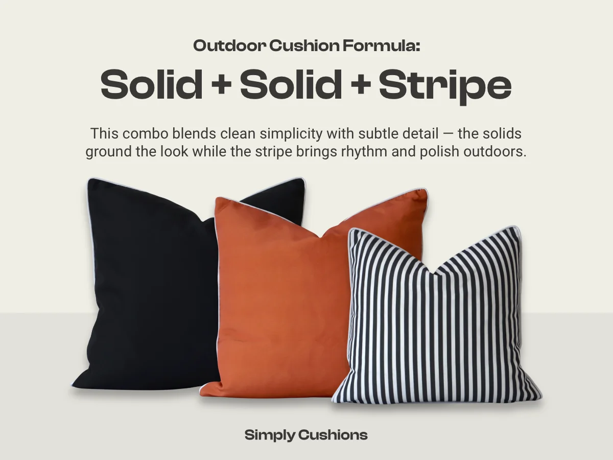 Outdoor cushion combination formula: solid + solid + stripe. S old black, terracotta and black striped outdoor cushion is shown in the example. This combo blends clean simplicity with subtle detail — the solids ground the look while the stripe brings rhythm and polish outdoors.