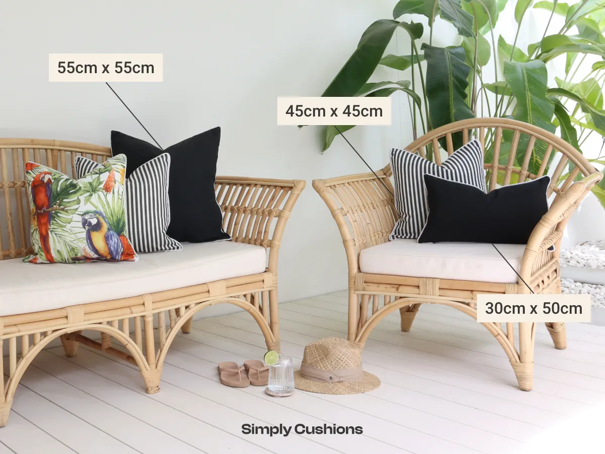 An outdoor lounge shown with a collection of outdoor cushion sizes labelled on product including; 55cm x 55cm, 45cm x 45cm, and 30cm x 50cm.