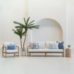 Set of 7 pacific cove outdoor sofa cushions is arranged neatly on a white sofa.