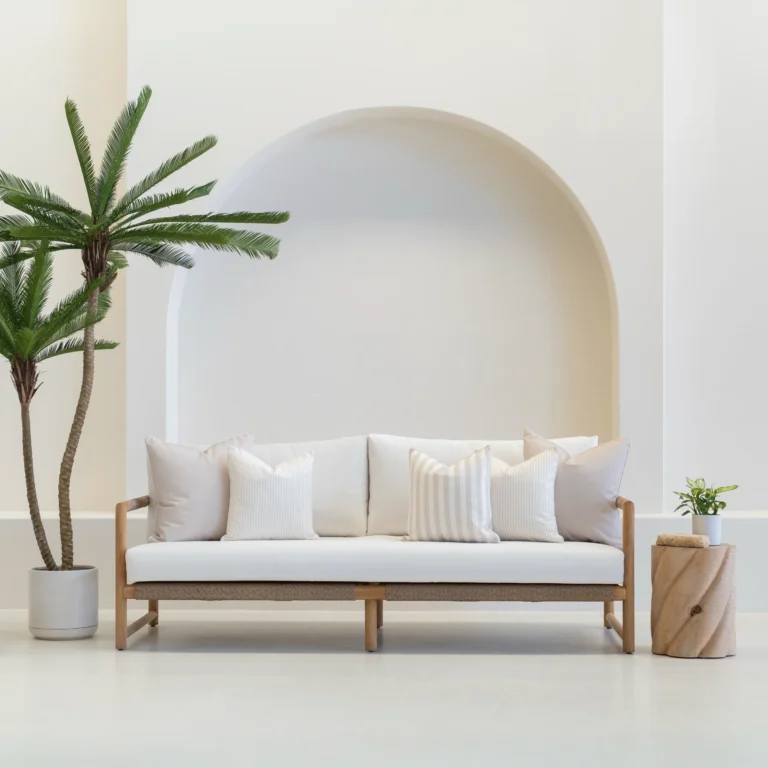 Outdoor seating with a set of 5 pacific sand outdoor sofa cushions on it.