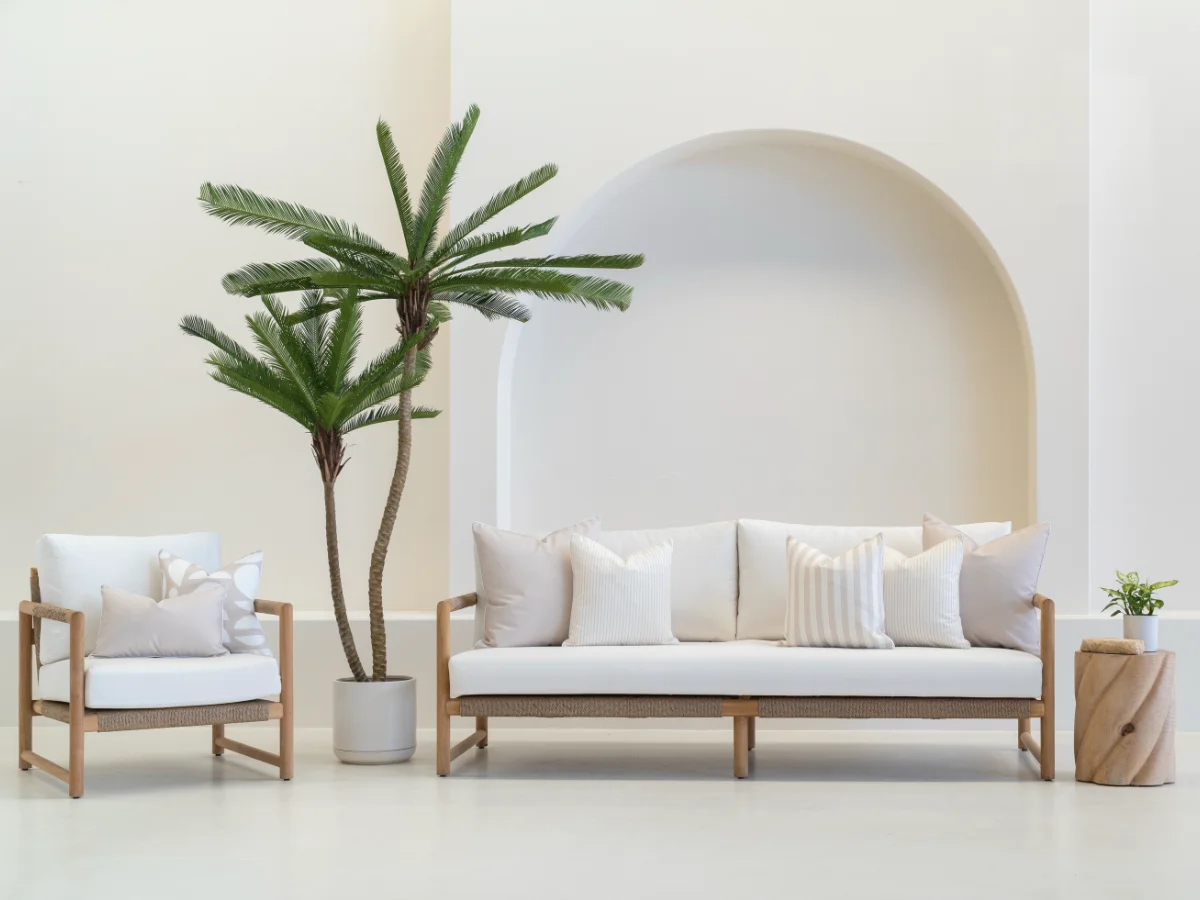 A large collection of beige outdoor cushions on a furniture setting showing how a neutral colour palette can look stylish.