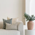 5 sofa cushions from the Sable set are showcased on a natura-coloured sofa.