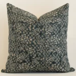 Gorgeous large linen cushion cover that has a dark moss green and natural hue. It has a graceful floral design.
