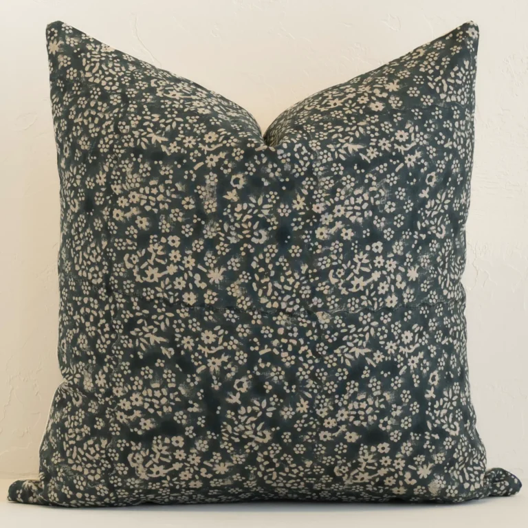 Gorgeous large linen cushion cover that has a dark moss green and natural hue. It has a graceful floral design.