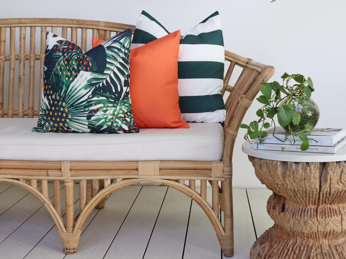 A vibrant set of orange, green and tropical outdoor cushions that show a stylish contrasting colour palette.