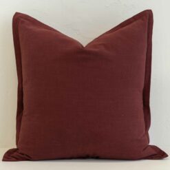 Burgundy linen cushion cover with a rich, deep colour and tailored edge finish.