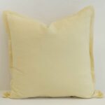 Butter yellow linen cushion cover with a gentle, uplifting tone and soft structured edge.