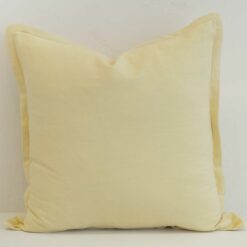 Butter yellow linen cushion cover with a gentle, uplifting tone and soft structured edge.