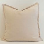 Cream linen cushion cover with a soft neutral tone and refined flange edge.