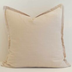 Cream linen cushion cover with a soft neutral tone and refined flange edge.