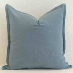 Dusty blue linen cushion cover with a calm, muted hue and tailored finish.