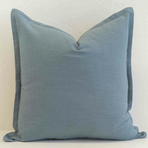 Dusty blue linen cushion cover with a calm, muted hue and tailored finish.