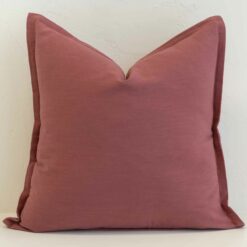Dusty pink linen cushion cover with a warm, understated blush tone and soft structure.