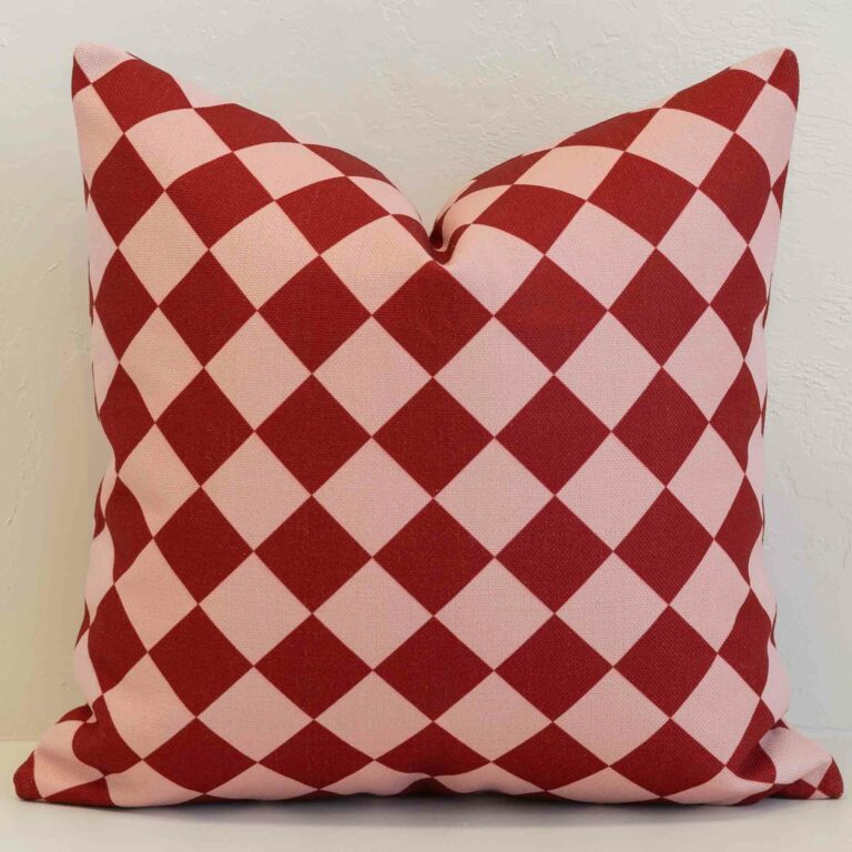 Diamond gingham cushion cover with a classic check design in rich red and soft blush.