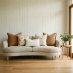 Marenca tan cushions styled on sofa with warm tones and balanced symmetry.