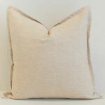 Oatmeal linen cushion cover in a soft, neutral tone with a subtle, organic texture.