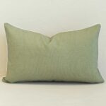 Pacific sage rectangular cushion with subtle textured fabric and white piping.