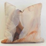 Abstract outdoor cushion cover in soft earthy hues, blending painterly textures for a calm and contemporary look.