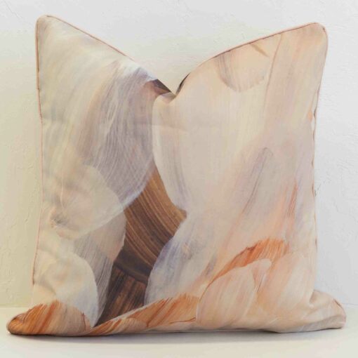 Abstract outdoor cushion cover in soft earthy hues, blending painterly textures for a calm and contemporary look.
