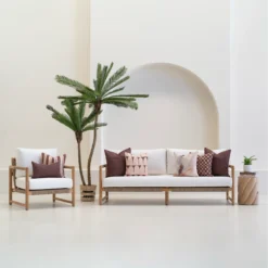 Solterra cushions set on outdoor sofa with brown and patterned designs.