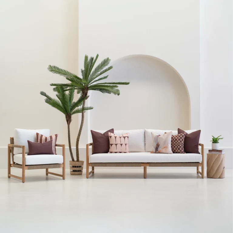 Solterra cushions set on outdoor sofa with brown and patterned designs.