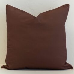 Chocolate brown outdoor cushion cover with a smooth, minimalist finish, offering a rich and grounding base for any outdoor setting.