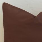 Rich chocolate brown outdoor cushion cover with a smooth, understated finish, offering depth and grounding to any outdoor setting.