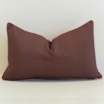 Rectangular outdoor cushion cover in deep brown, designed for a clean, understated look that pairs effortlessly with patterned styles.
