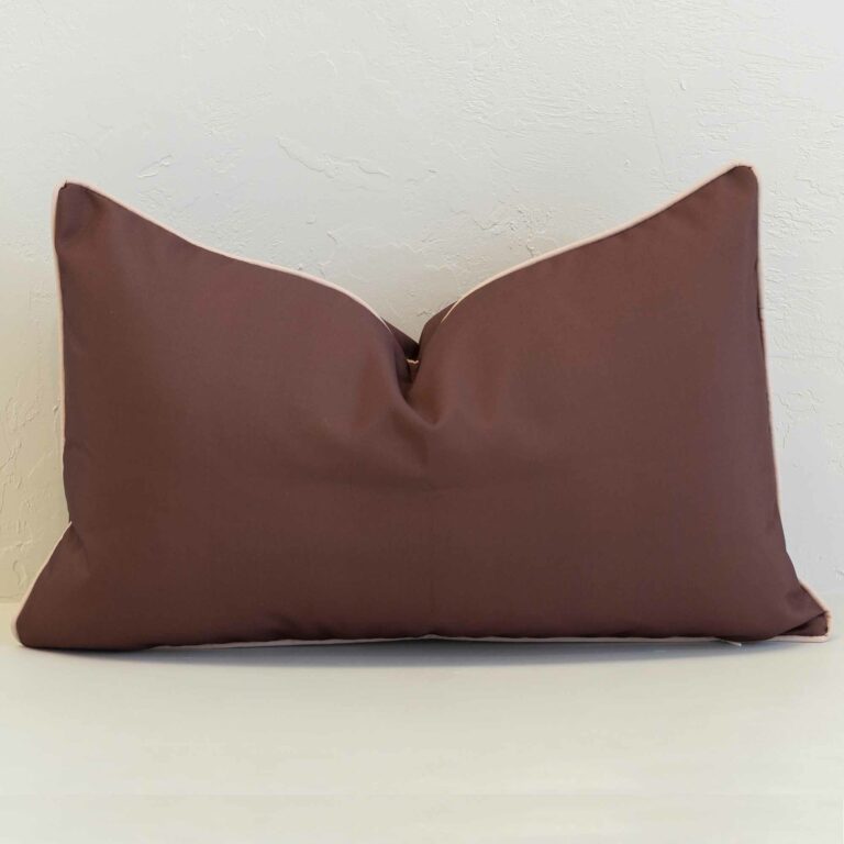 Rectangular outdoor cushion cover in deep brown, designed for a clean, understated look that pairs effortlessly with patterned styles.