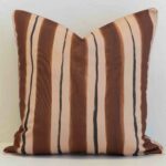 Solterra striped cushion with brown, beige and thin dark vertical lines.