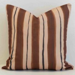 Solterra striped cushion with brown, beige and thin dark vertical lines.