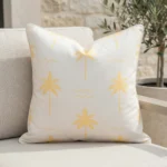Tropica lemon yellow cushion with palm tree pattern on outdoor seating.