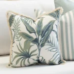 Close-up of Wildgrove Palm cushion with leafy pattern and textured fringe.